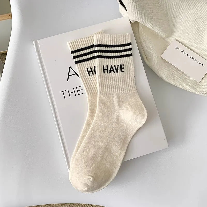 Couple-style socks for cross-border export. Women's style winter and autumn mid-length socks in white. Men's socks.